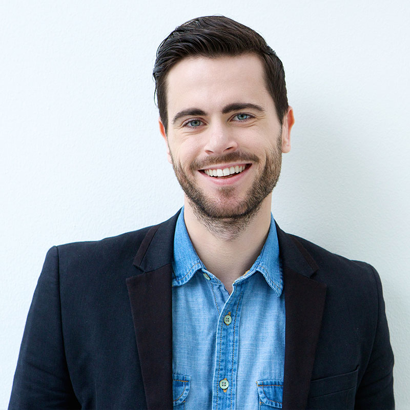 portrait of a smiling young man 1 1 مجتبی صیدی دکتر دندان پزشک